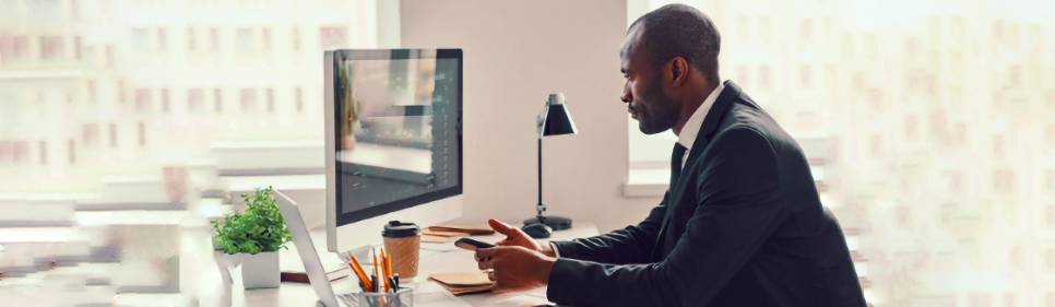 Man at desk using computer
